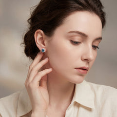 Blue Topaz and Diamond Halo Stud Earring